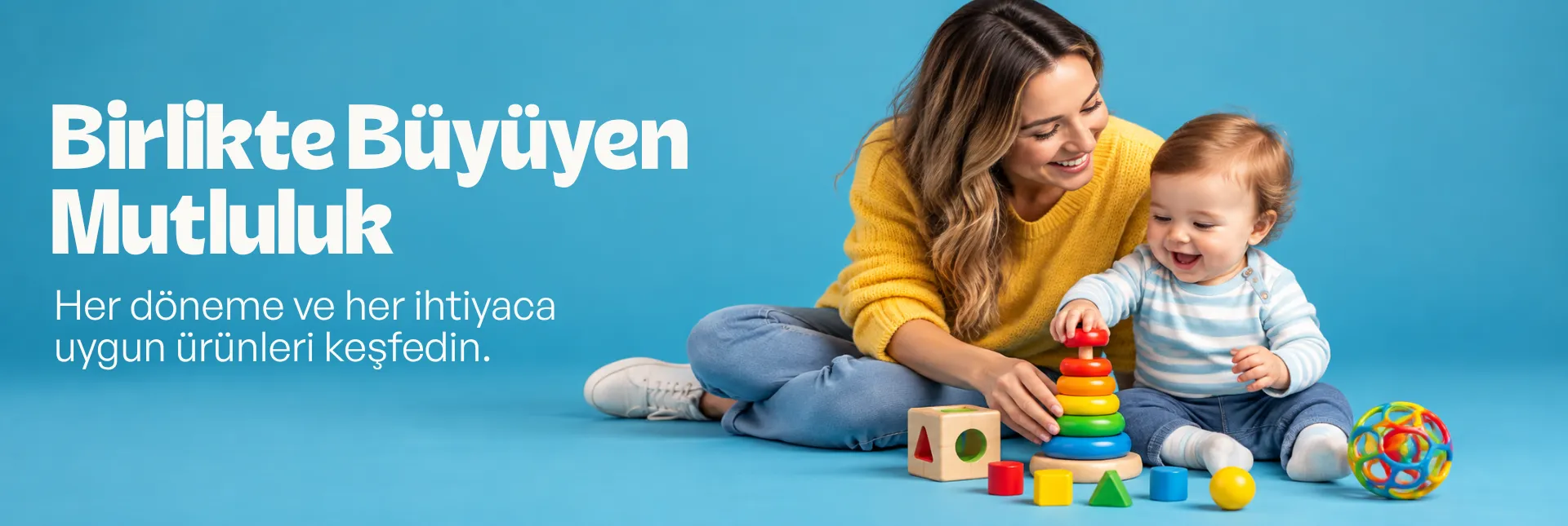 Anne ve bebeğin renkli gelişim oyuncaklarıyla oynadığı anne, bebek ve çocuk ürünleri
