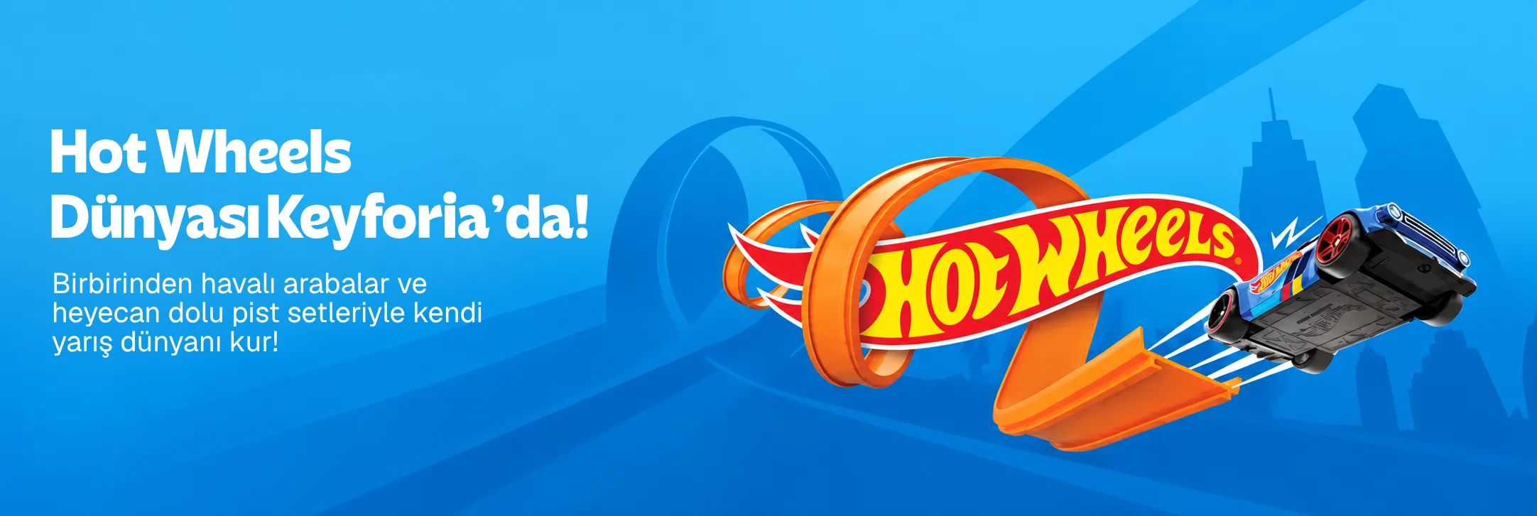 Hot Wheels logosu, turuncu yarış pisti ve mavi oyuncak araba bulunan Keyforia bannerı.